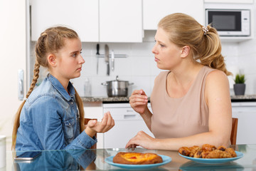 Mother and daughter having conversation