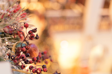 Gold Christmas background of de-focused lights with decorated tree