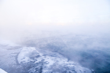 Winter landscape of frosty trees, white snow in city park. Trees covered with snow in Siberia, Irkutsk near lake Baikal. Extremely cold winter