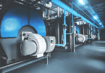 Modern industrial gas boiler room equipment for heating system. Heating boilers, pipelines, valves