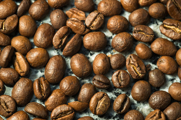 grains of black coffee on a granite table