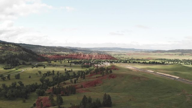 Devil's Tower National Monument and surrounding landscape in summer season. Beautiful aerial view on a sunny afternoon
