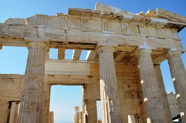 Obraz premium Athens, Greece, 10.28.2019. Fragment of Propylaea, entrance to the Athenian Acropolis on a bright day - world heritage site. Religious building of ancient times. 