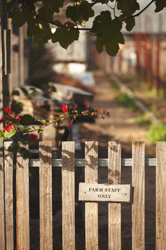 Close up of entrance gate of farm with text Farm Staff Only