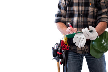 Carpenter isolated on white background writes work notes on a notebook. Work tools industry construction and do it yourself housework. Stock photography.