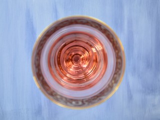 rose wine in a glass on a light background with space for text
