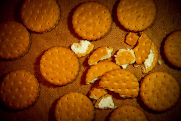 homemade, shortbread, milk cookies as a gift on a wooden background, with a rope