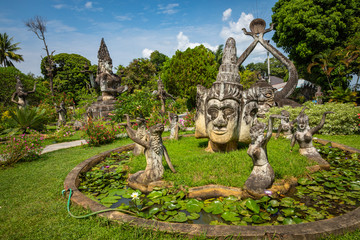 Buddha park Xieng Khouane in Vientiane, Laos. Famous travel tourist landmark of Buddhist stone statues and religious figures.