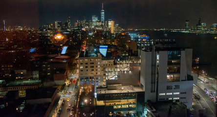Fototapeta na wymiar Manhattan streets and Lower Manhattan night aerial skyline, New York City