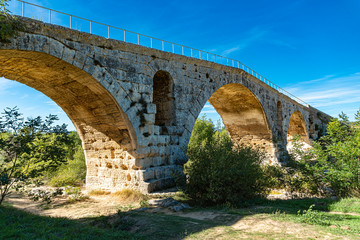 Fototapeta na wymiar Antique roman bridge made with stones, Europe