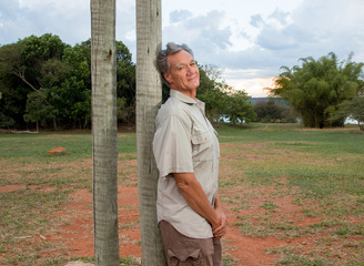 Mature Man hanging out at the park wearing casual clothes 