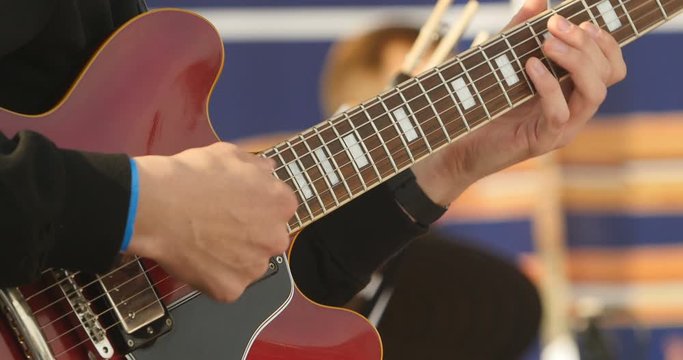 Guitarist  play electricity guitar close-up 