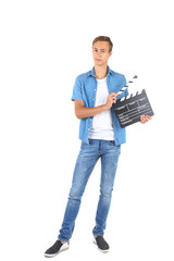 Young man with clapper board isolated on white background