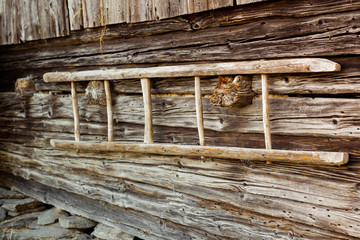 old wooden staircase on the cottage wall