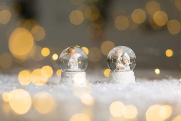 Decorative Christmas-themed figurines. Glass ball with snowflakes in which the Christmas angel...