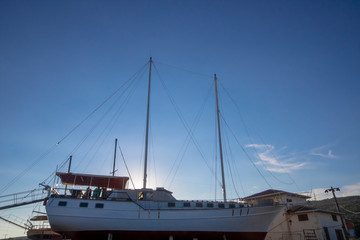 Naklejka premium The boat on the scaffolding at the port.