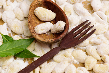 Homemade gnocchi, prepared on the table with ingredients.