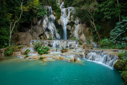 Turquoise water of Kuang Si waterfall, Luang Prabang, Laos. Tropical rainforest. The beauty of nature. © Curioso.Photography