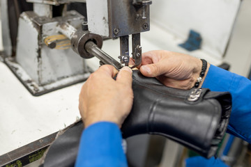 Machine for trimming excess sticking lining. Shoe production.