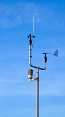 Wind gauge (anemometer) in front of blue sky in Hohwacht, Schleswig-Holstein on the Baltic Sea,...