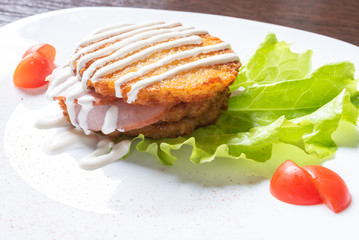 Potato pancakes with ham and herbs.
