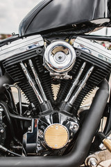 Close up detail of a powerful vintage motorcycle - large carburetor engine
