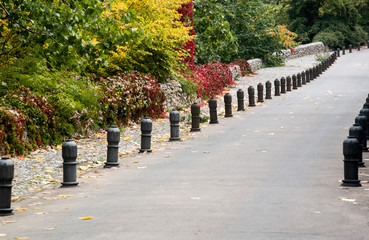 road with anti parking bollards in autumn