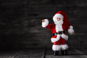 Santa Claus toy on wooden rustic background
