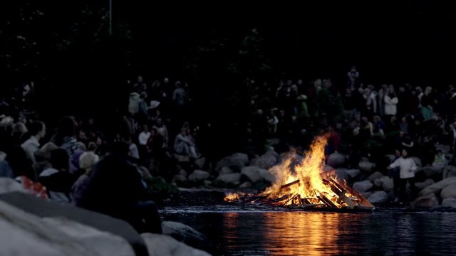 Blurred Shot of a Group of People Gathered Around Bonfire During Midsummer Day