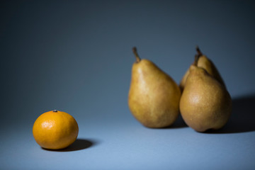 Ripe fruits on a gray background shot closeup