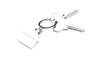 Silver keys with house symbol isolated on white background