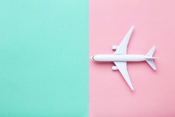 Airplane model on colorful paper background