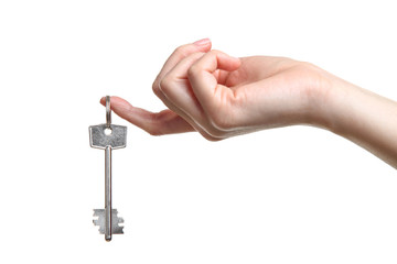 Female hand holding house key on white background
