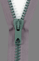 A very closeup pic of an unzipped zipper