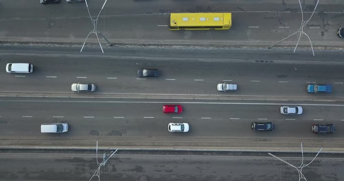 City road with passing cars. 4K video, 240fps, 2160p.