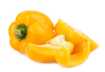 Fototapeta na wymiar Whole and cut yellow bell peppers isolated on white
