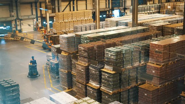 A forklift drives through a warehouse of industrial products