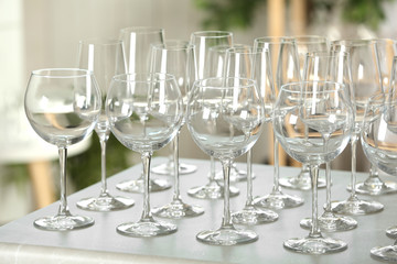 Set of empty glasses on grey table