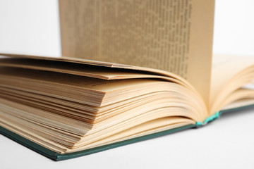 Closeup view of open book on white background