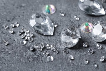 Fototapeta premium Beautiful gemstones for jewelry on grey background, closeup