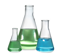 Glassware with liquids isolated on white. Laboratory analysis