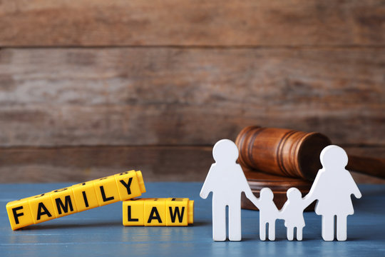 Figure In Shape Of People, Cubes With Words Family Law And Gavel On Blue Wooden Table