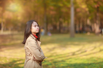 young woman in autumn park at Nami island South Korea