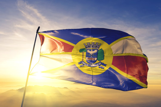 Jau of Brazil flag waving on the top sunrise mist fog