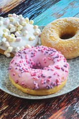 Sweet colorful dessert. Donut with a hole and pink delicious icing.