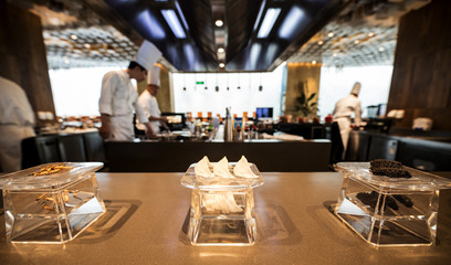 Traditional preparing food and professional Chinese cooks at kitchen.