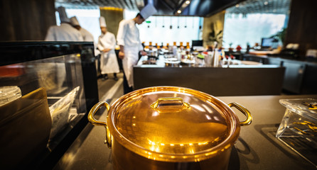 Traditional preparing food and professional Chinese cooks at kitchen.