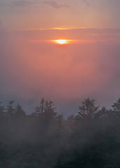 Fototapeta na wymiar Fog Rolls Over the Mountains and Sunset at Clingman's Dome in the Great Smoky Mountains National Park