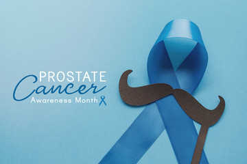 Light blue ribbons with mustache on blue background , Prostate Cancer Awareness, Men health...
