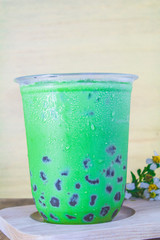 Pearl green tea placed on a wooden table